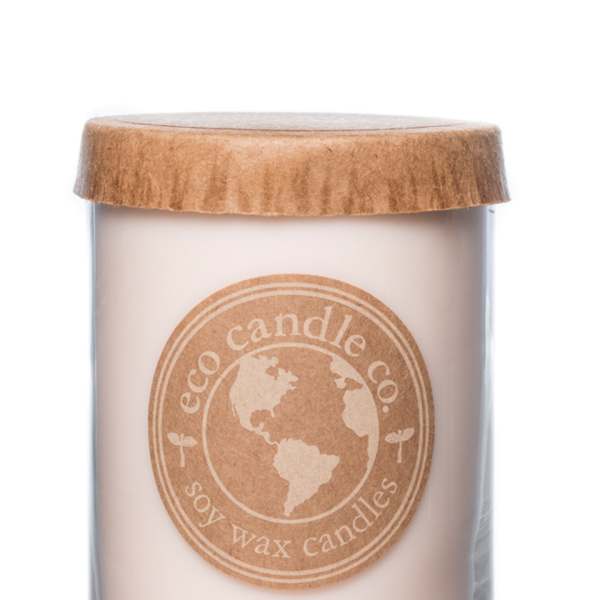 Soy wax candle in a glass jar with a wooden lid