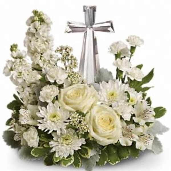White floral cross arrangement with a silver ribbon bow