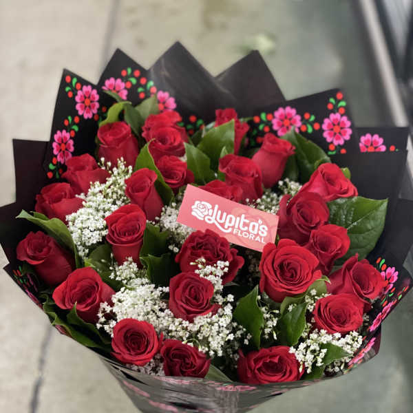 Bouquet of red roses with baby's breath in black wrap