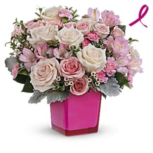 Pink and white rose bouquet in a magenta vase with a ribbon accent