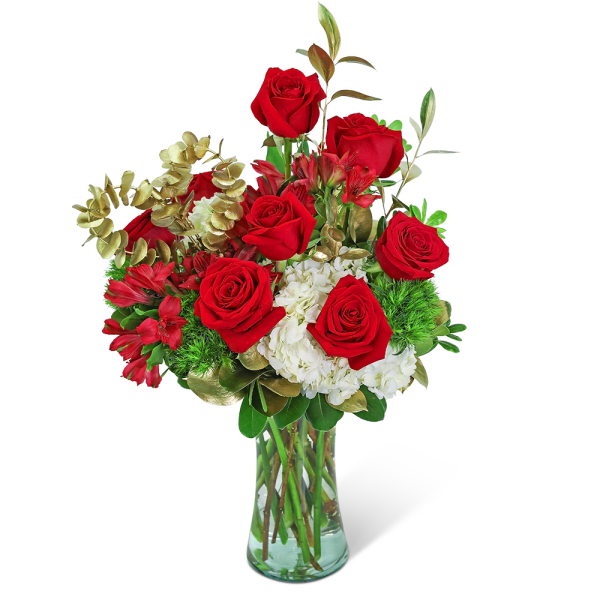 Bouquet of red roses and white flowers in a clear glass vase