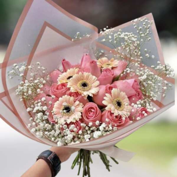 Pink rose bouquet with pale gerbera daisies and baby's breath