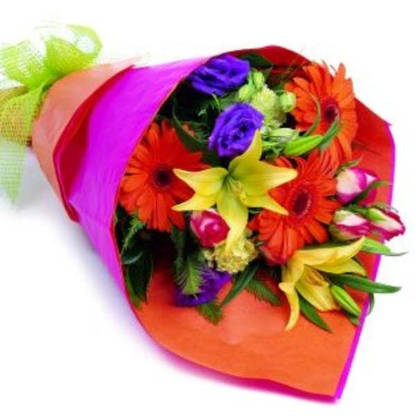 Bright mixed bouquet wrapped in pink and orange paper