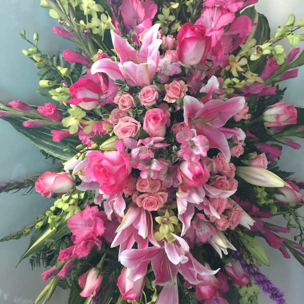 Large pink floral spray with lilies and roses