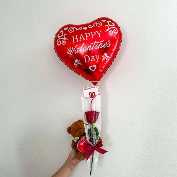 Red heart-shaped Valentine balloon with a rose and teddy bear