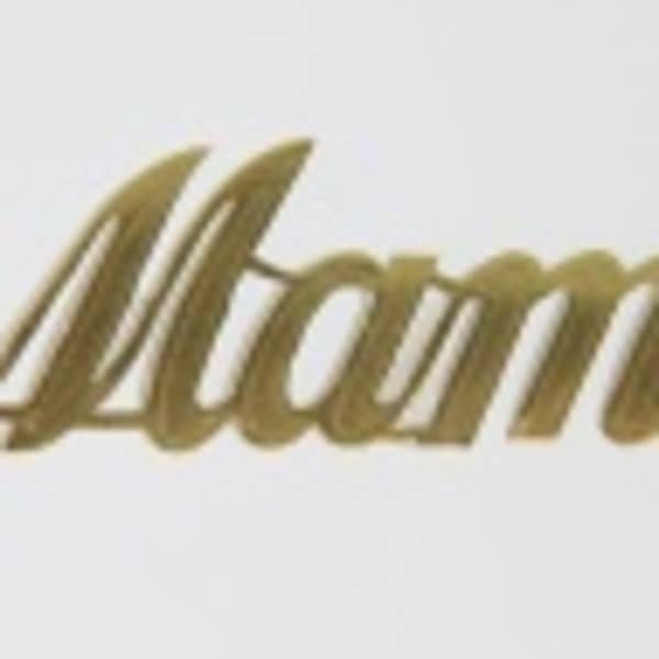 Gold script reading "Mama" on a white background