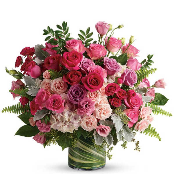 Pink and lavender rose bouquet in a glass vase