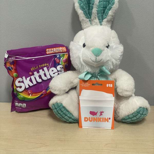 Plush bunny with a Skittles bag and Dunkin' gift card