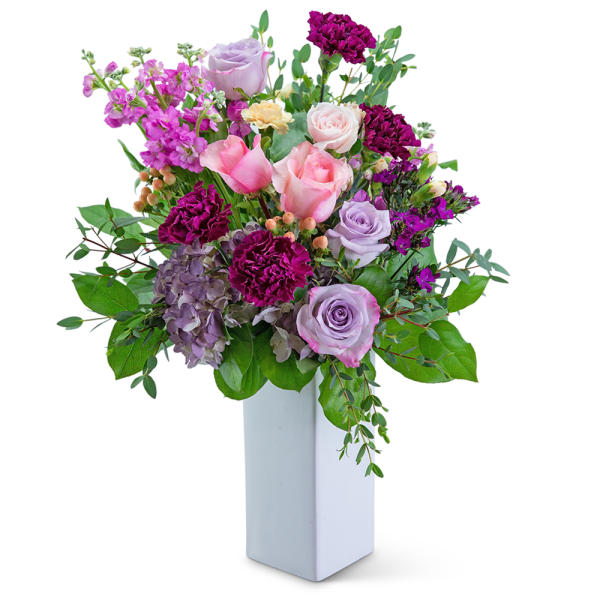 Mixed pink and lavender bouquet in a white vase
