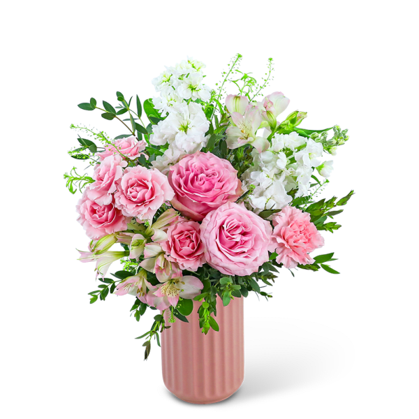 Pink roses and white flowers arranged in a pink vase