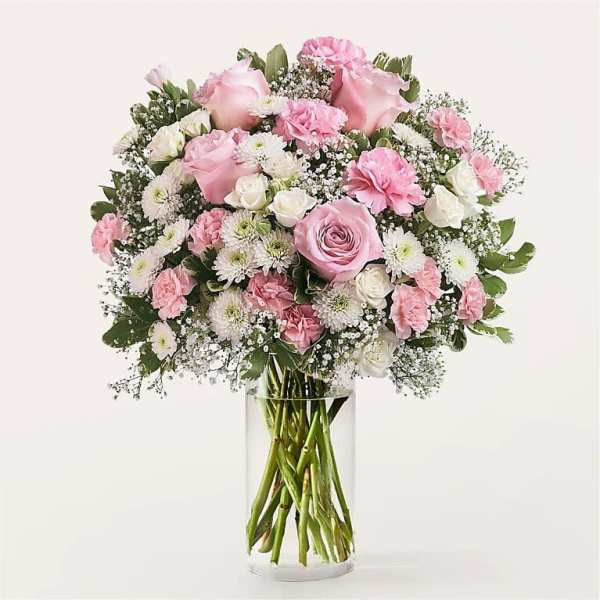 Pink and white mixed bouquet in a clear glass vase