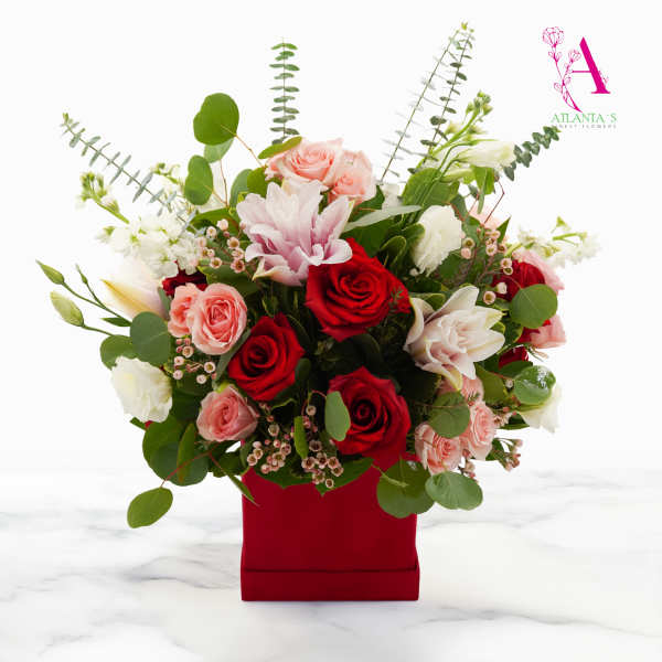 Mixed bouquet of red and pink roses in a red box