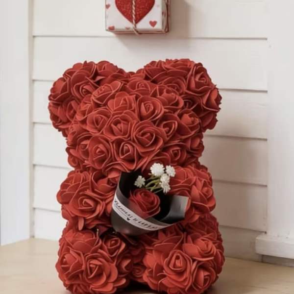 Red rose teddy bear with a small gift box and Mother’s Day sign