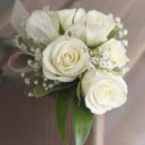 White rose bouquet with small filler flowers and ribbon wrap