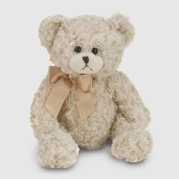 Cream-colored teddy bear with a satin bow