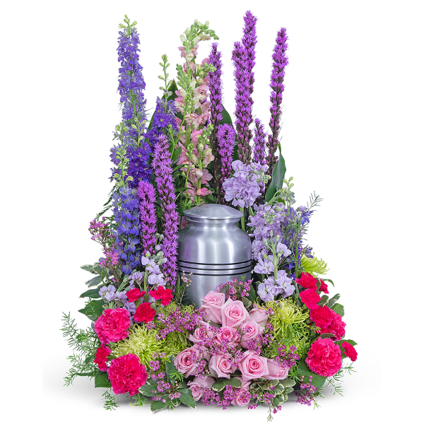 Tall floral funeral urn arrangement with pink, purple, and green flowers