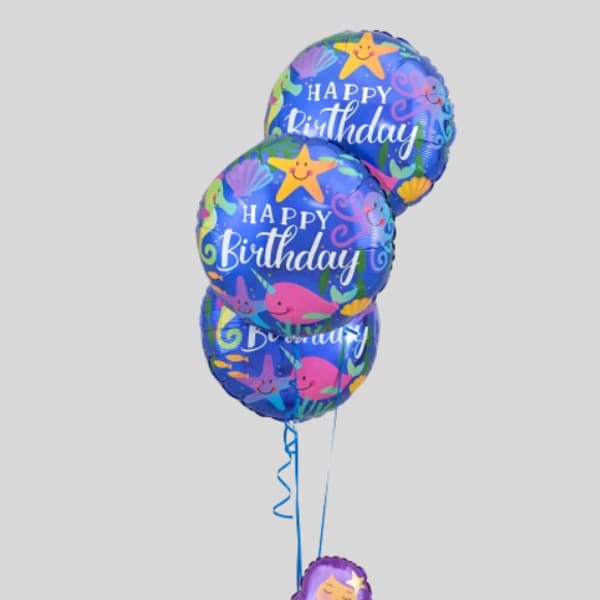 Birthday balloon bouquet with three blue balloons and a mermaid balloon topper