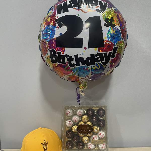 Birthday balloon with chocolates and a yellow cap