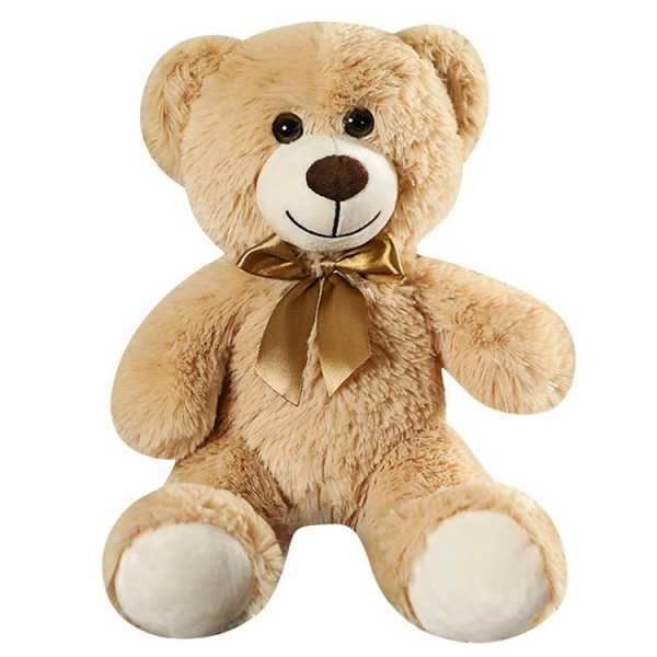 Tan teddy bear with a gold ribbon bow on a white background