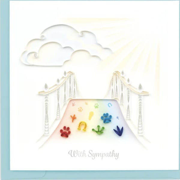 Sympathy card with rainbow paw prints and a bridge under clouds