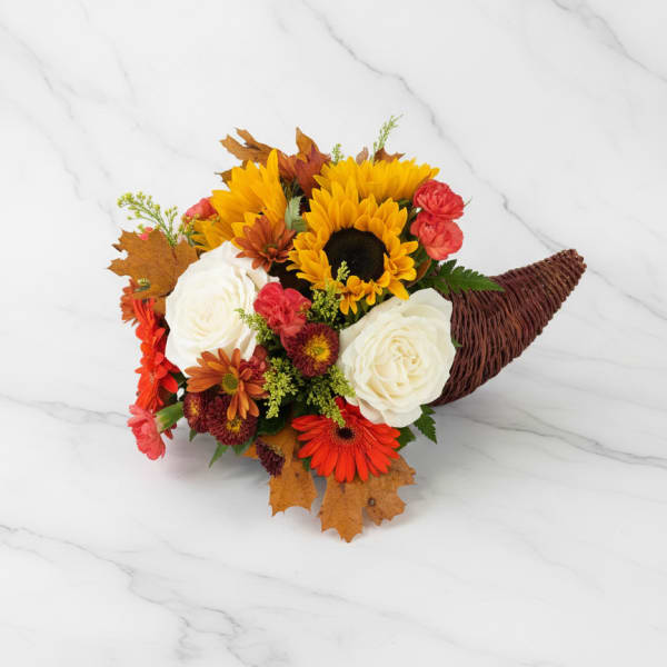 Autumn bouquet with sunflowers, white roses, and orange blooms