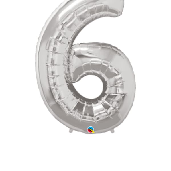 Silver foil balloon shaped like the number 6