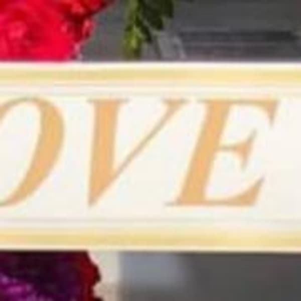 Banner reading I LOVE YOU SISTER over red and purple flowers