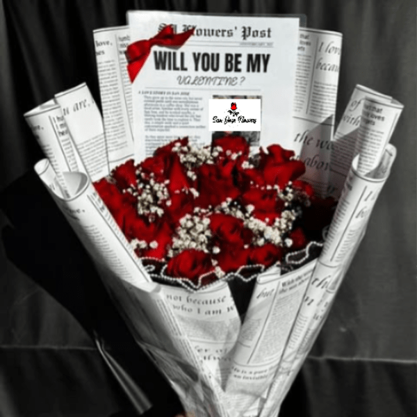 Bouquet of red roses wrapped in newspaper with a red ribbon