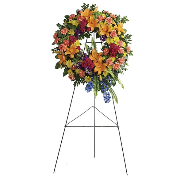 Colorful funeral wreath on a standing easel