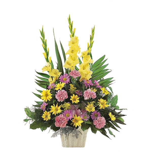 Tall floral arrangement with yellow gladiolus and pink and yellow daisies in a vase