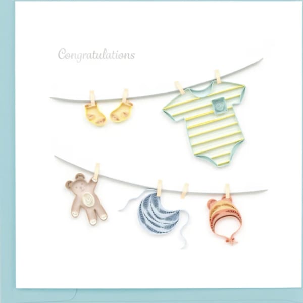 Baby-themed congratulations card with clothesline cutouts and a teddy bear
