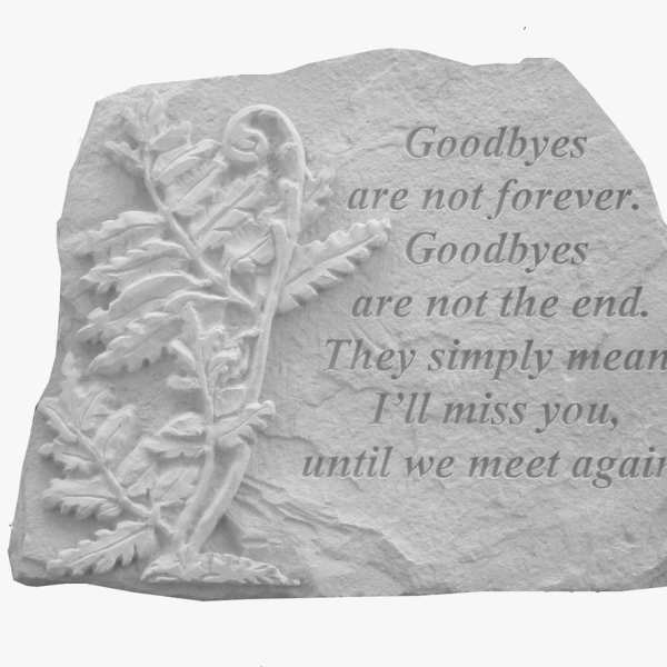 Stone memorial plaque with an engraved leaf and farewell quote