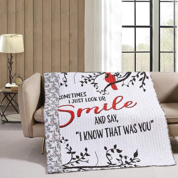 Quilted throw blanket with a cardinal and the words "Smile" and "I know that was you"