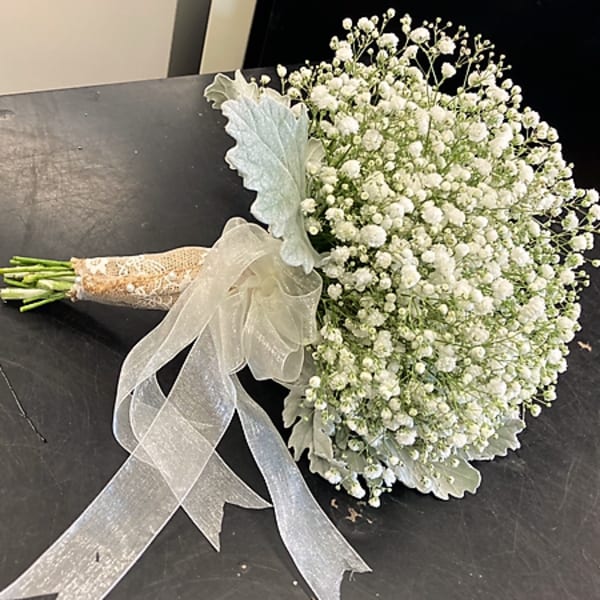 White baby's breath bouquet with a sheer ribbon wrap