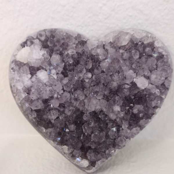 Heart-shaped crystal ornament with purple and clear stones