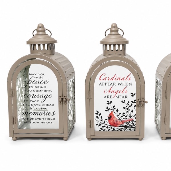 Three decorative lanterns with printed memorial and home quotes