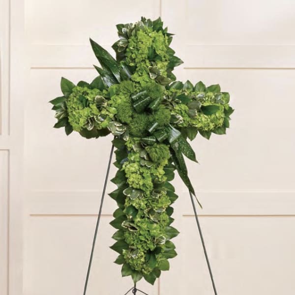 Green floral cross on a standing easel