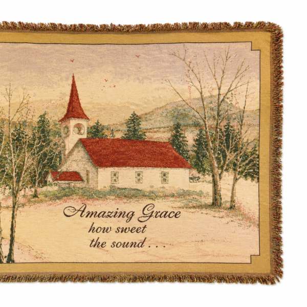 Fringed wall hanging with a church scene and the words Amazing Grace