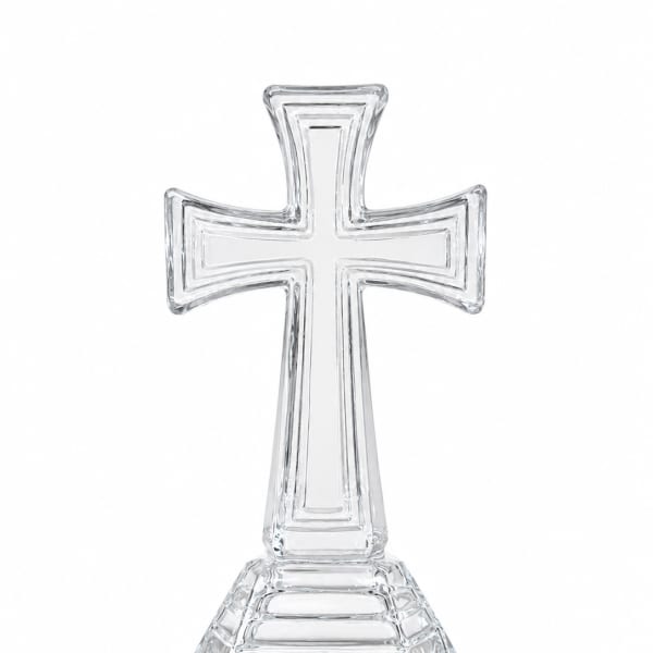 Clear glass cross-shaped decorative stand on a white background