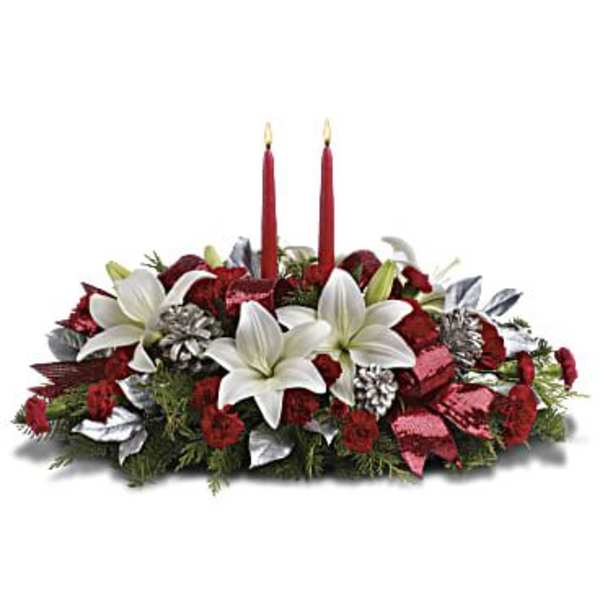 Red and white floral centerpiece with two red candles