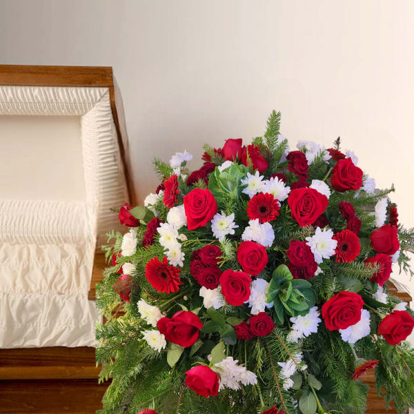 Large red and white floral spray with roses and daisies