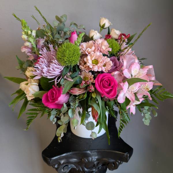 Mixed pink and white bouquet in a white vase