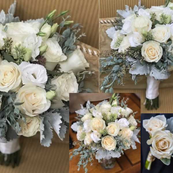 White rose bouquet with pale greenery and a wrapped handle