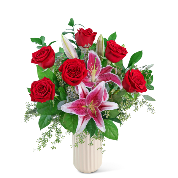 Red roses and pink lilies in a white vase