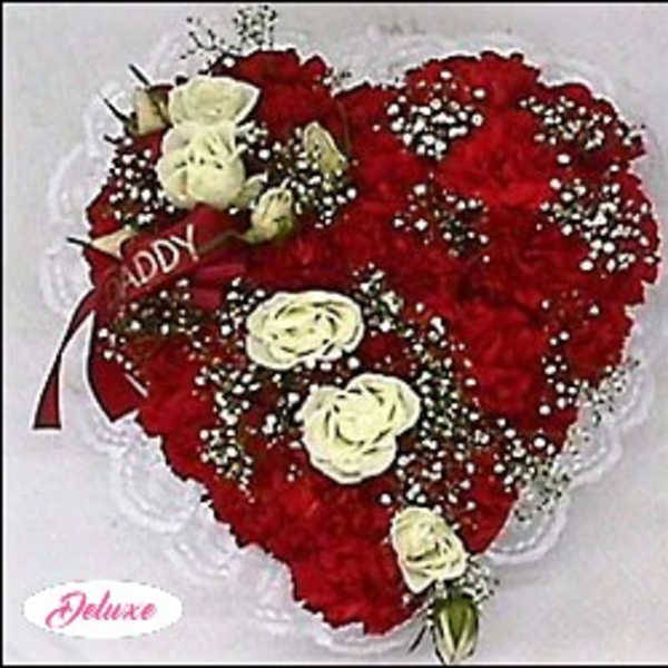Heart-shaped bouquet of red carnations with white roses and baby's breath