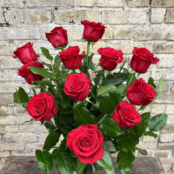 Bouquet of red roses in a clear glass vase