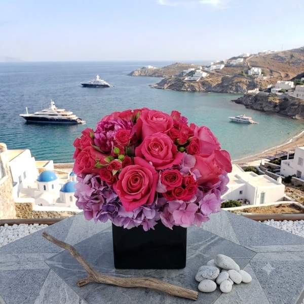 Pink rose and hydrangea arrangement in a black square vase