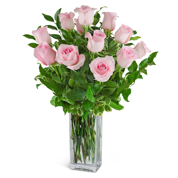 Pink roses arranged in a clear glass vase