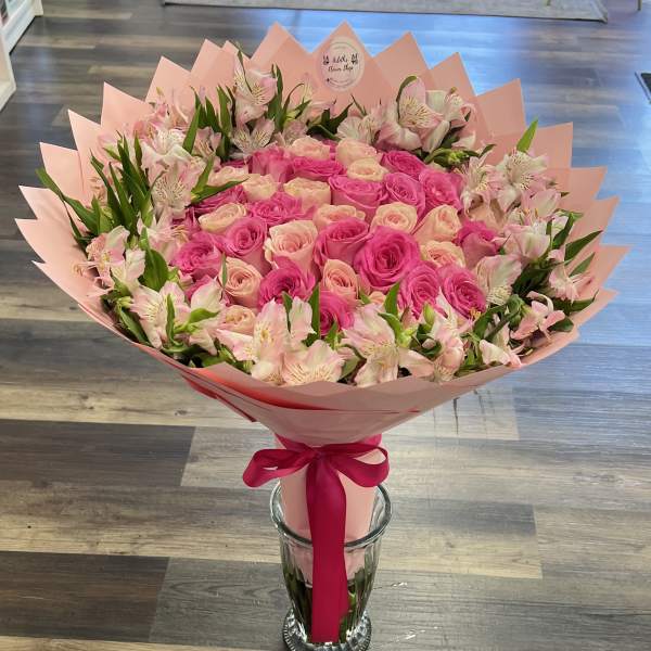 Pink rose bouquet with alstroemeria in pink wrap and ribbon