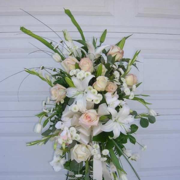 Tall white and blush floral spray on a stand